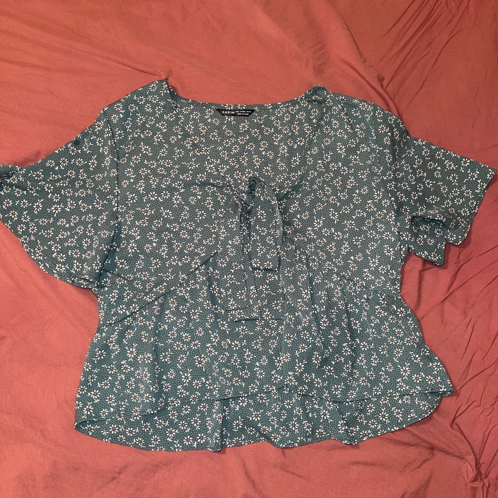 Green floral blouse.